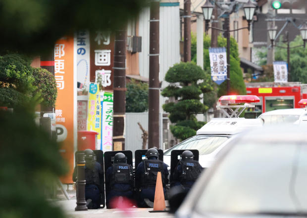 An individual believed to be armed takes hostages at a post office in Japan.