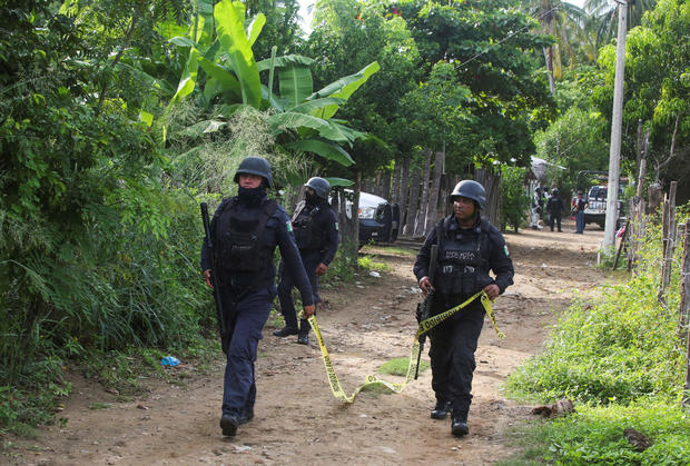 At least 24 people, including at least 12 police officers, were killed in a series of attacks in Mexico.