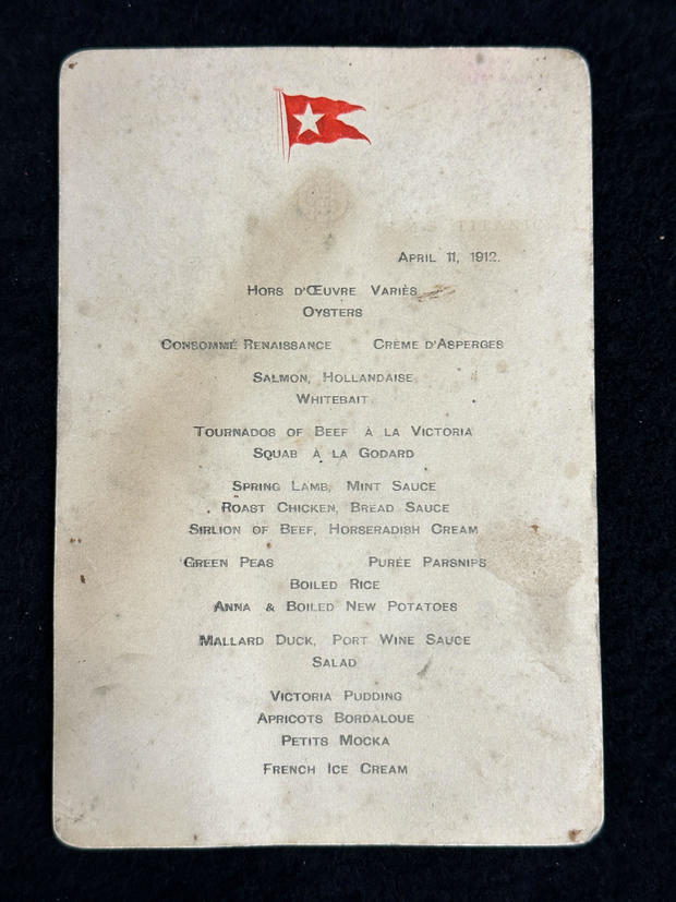 The first-class menu from the Titanic and a pocket watch belonging to a victim were both sold at an auction for more than $100,000 each.