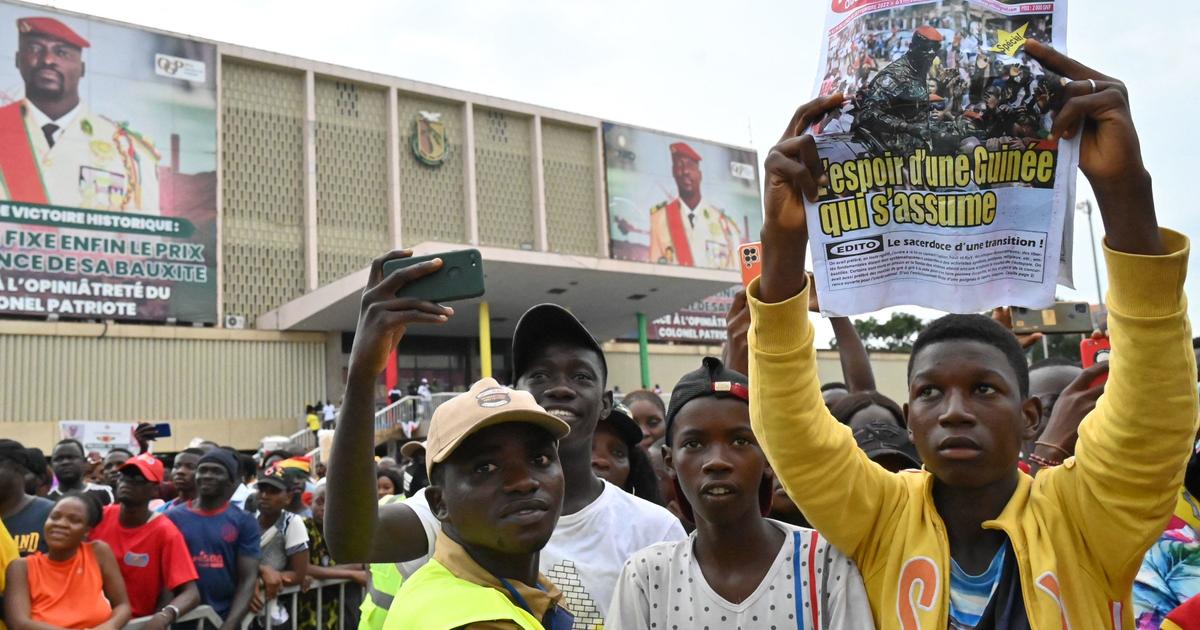 The former dictator of Guinea, along with two accomplices, has fled from prison following an attack by armed individuals on the capital city, according to the justice minister.