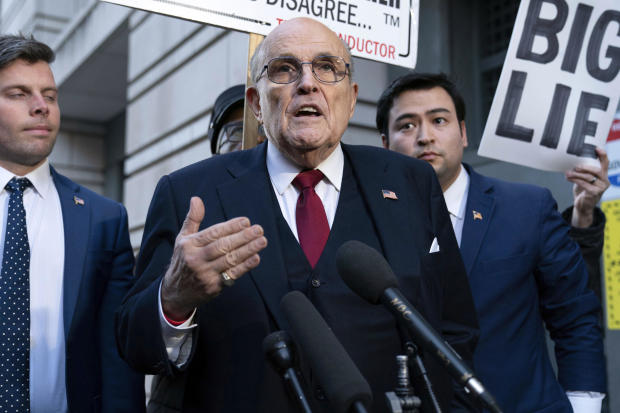 Rudy Giuliani speaks to reporters outside the federal courthouse in Washington, D.C., on Friday, Dec. 15, 2023. 
