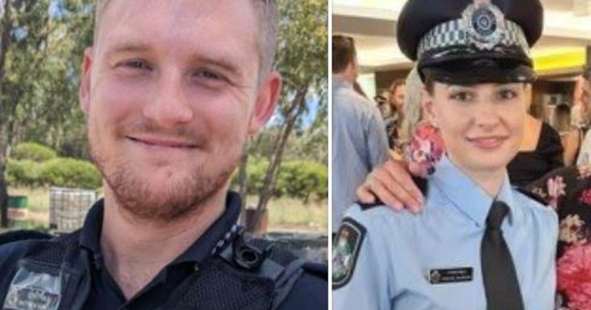An Arizona man has been accused of instigating a "terrorist attack motivated by religion" that resulted in the deaths of two officers and a bystander in Australia.