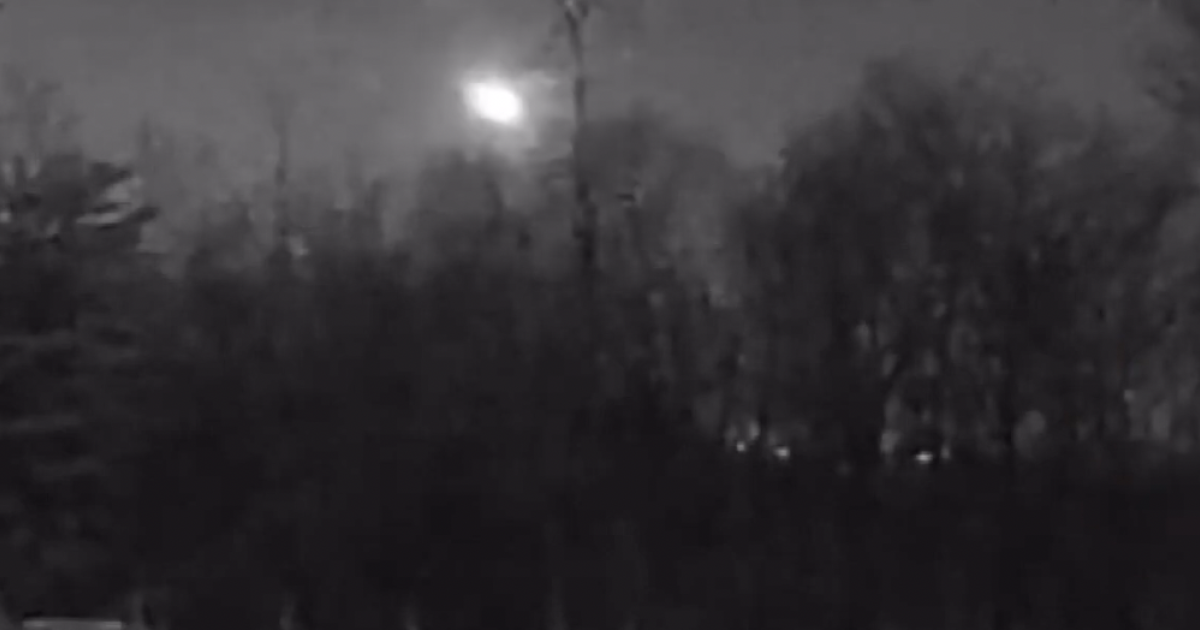 A huge fireball illuminates the night sky over a significant portion of the United States.