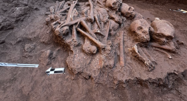 A large collection of ancient skulls and bones were discovered piled on top of each other during a construction project in Mexico.
