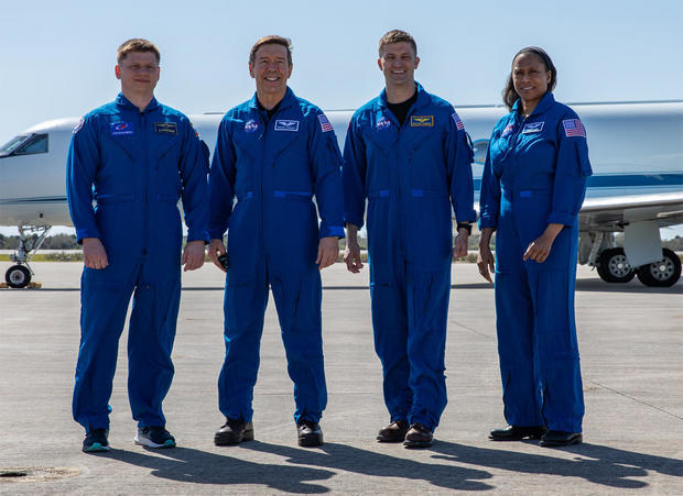 A team of four individuals, consisting of three men and one woman, travels to Florida to prepare for a launch to the space station on Friday.