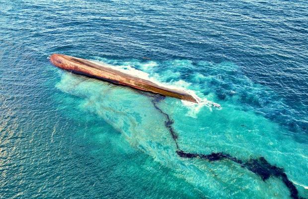 A vessel of unknown origin overturns in Trinidad and Tobago, causing a significant oil spill and prompting a state of emergency.