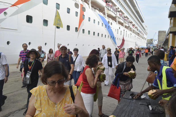 Numerous individuals stuck on Norwegian Dawn cruise liner affected by suspected cholera outbreak.