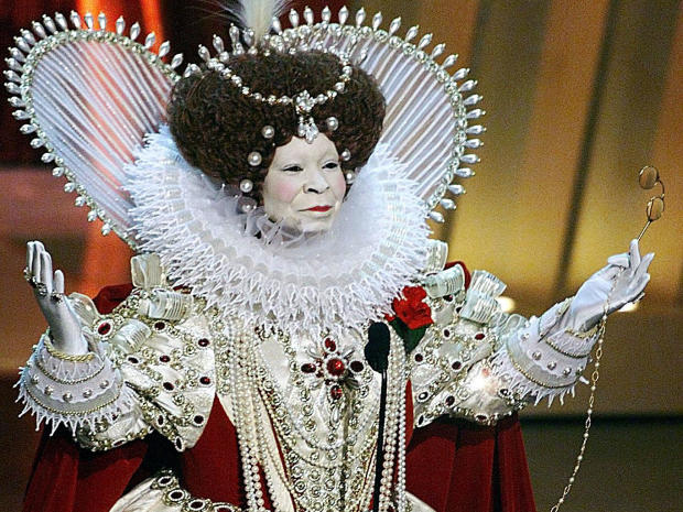 Whoopi Goldberg, dressed as Britain's Queen Elizabeth I, who was portrayed in 