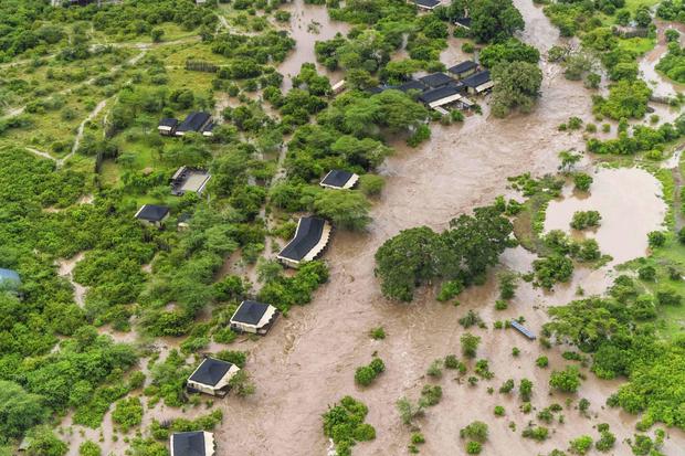 Kenya floods hit Massai Mara game reserve, trapping tourists who climbed trees to await rescue by helicopter