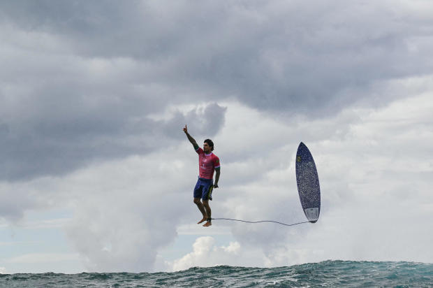 As stunning Olympic surfing photo goes viral, some question whether it's too good to be true