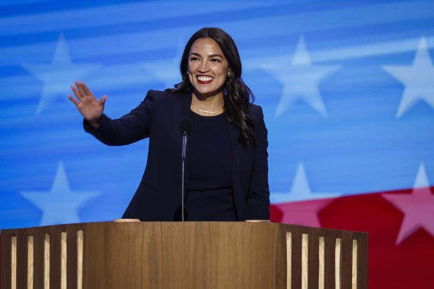 Rep. Alexandria Ocasio-Cortez urges Democrats to "choose a new path" in raucous DNC speech