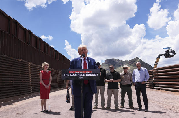 Trump visits border wall in Arizona, trades accusations with Democrats on immigration policy