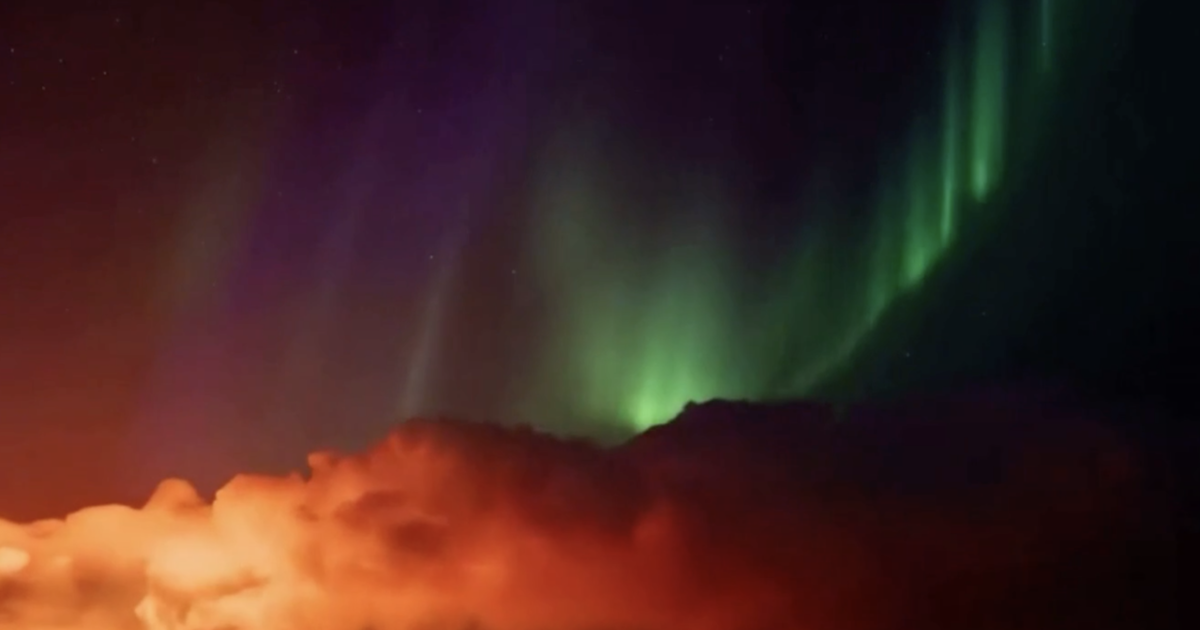 Video shows northern lights shining over erupting Iceland volcano