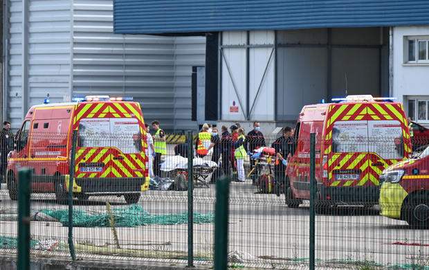 At least 12 dead after a boat with dozens of migrants rips apart in waters off northern France