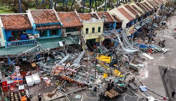 Typhoon Yagi hits Vietnam with torrential rains, killing almost 60 as vehicles and a bridge are swept away