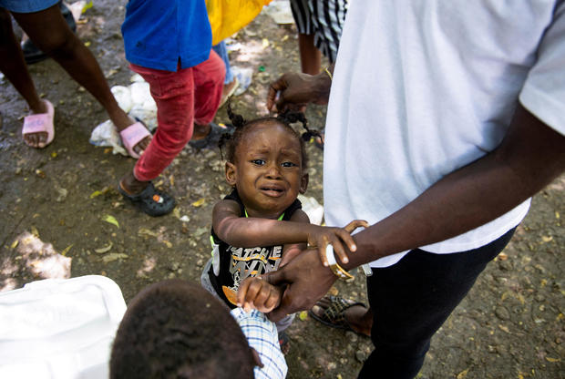 Haiti's gangs luring more children into crime and sexual abuse, HRW says, as 115 people killed in attack