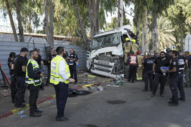 Truck slammed into bus stop near Tel Aviv killing 1, injuring dozens