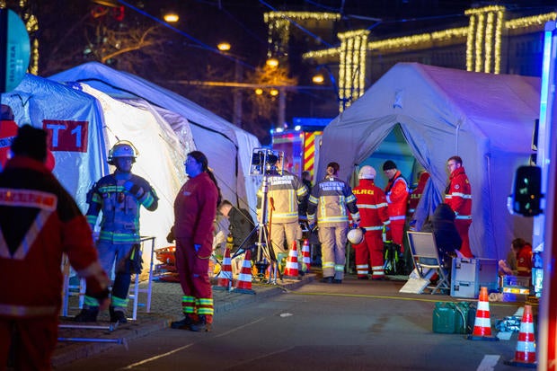 Car slams into crowd at Christmas market in Germany in suspected attack; at least 2 killed, dozens injured, officials say