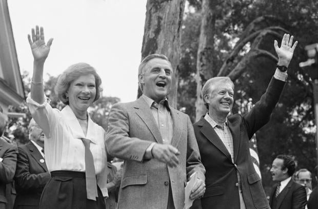 Democratic presidential candidate Walter Mondale, center, flanked by former President Jimmy Carter and his wife Rosalynn Carter, at a 1984 campaign event 