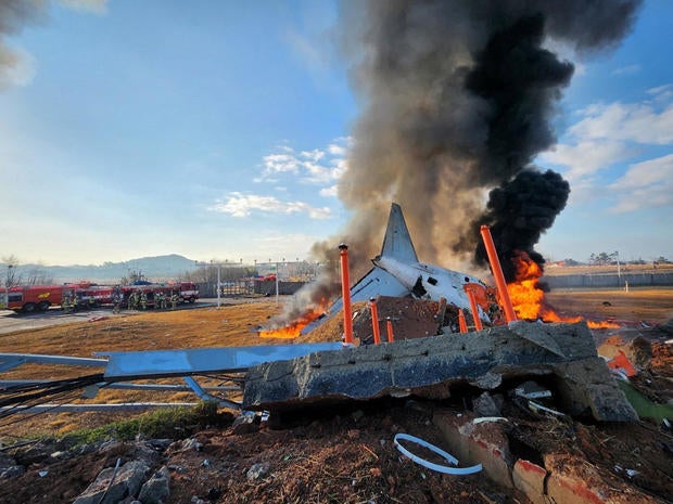 Passenger jet engulfed in flames after crash-landing in South Korean airport, killing 179; 2 crew members survived