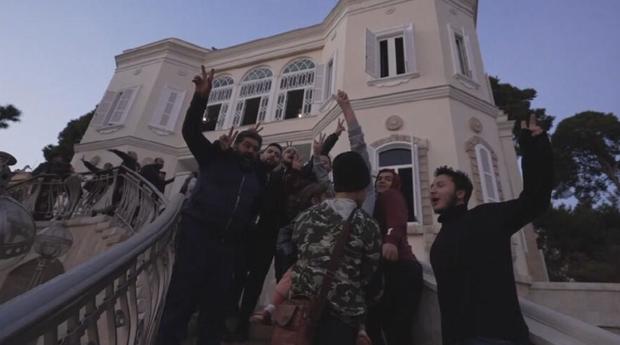 Syrians elated but anxious as they pore over ousted Assad's palace