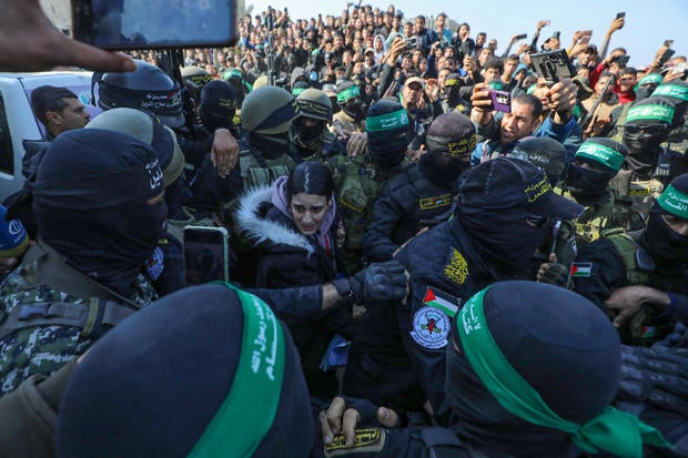 1 Israeli female hostage held in Gaza handed over to Red Cross teams 