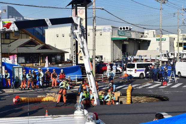 Massive sinkhole swallows truck in Japan, trapping driver inside