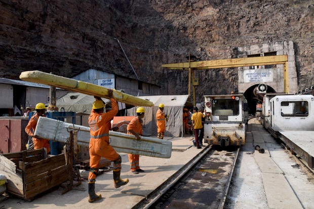 India tunnel collapse sparks race to find 8 trapped workers, but chances of survival deemed "very remote"