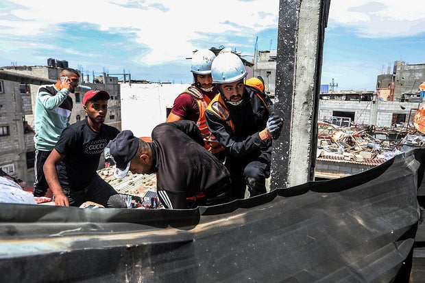Death toll in Gaza rises to 52,000, territory's health ministry says, as Israel continues offensive